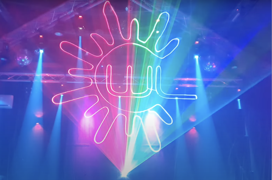 image_2022_01_13T07_01_34_291Z Holographic laser light design by Lasercube being used in a club, showing 3D lights projection over smoke.