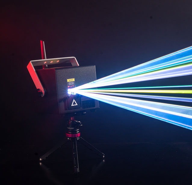 A lasercube laser light projector creating laser lights for a laser show with beams going to the right.