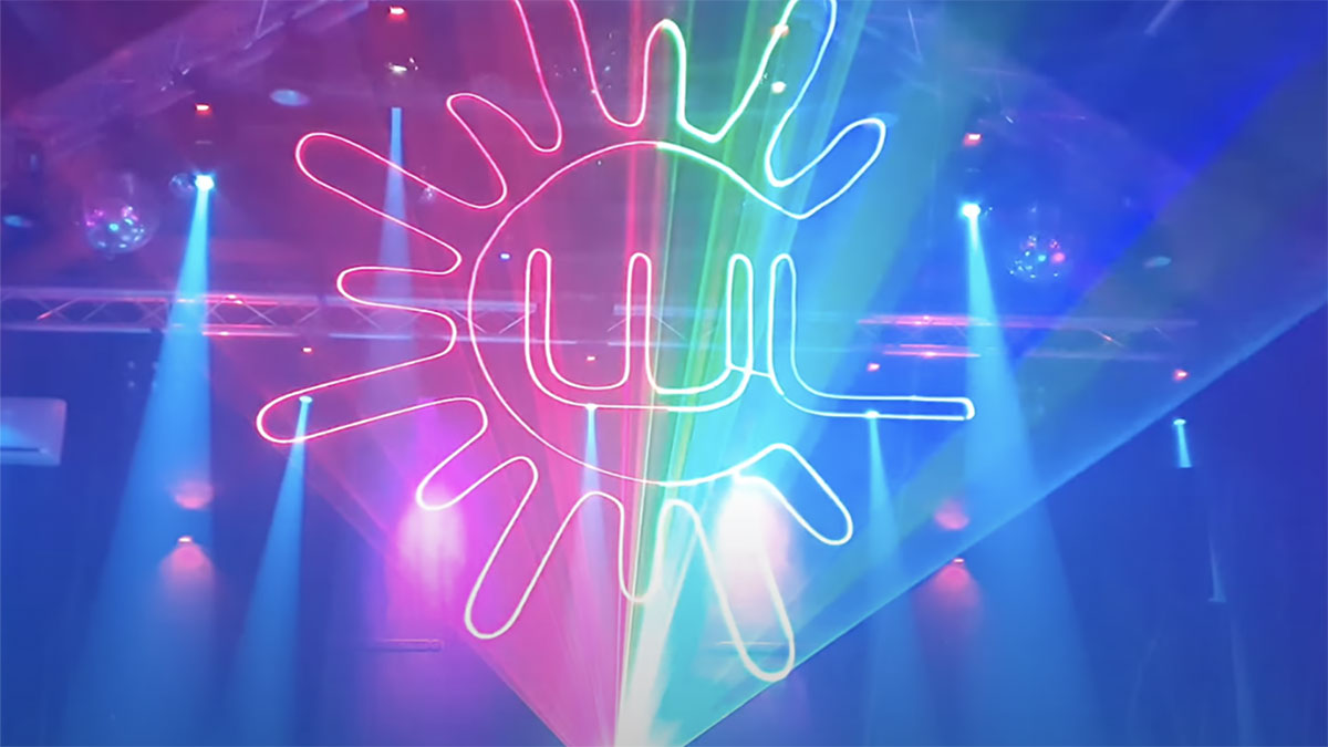 Holographic laser light design by Lasercube being used in a club, showing 3D lights projection over smoke.