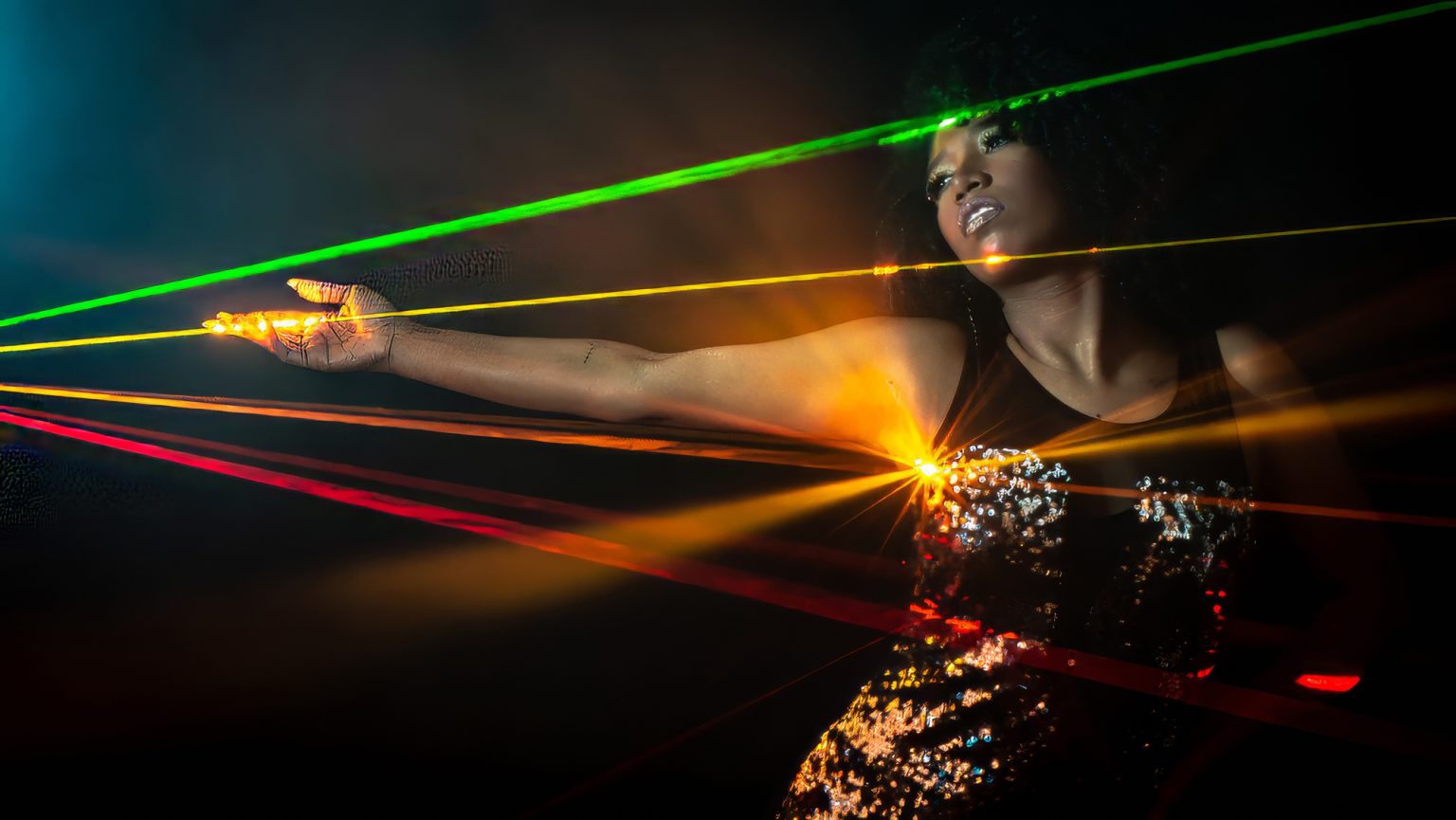 Laser lights projected onto a lady via the lasercube laser show projector