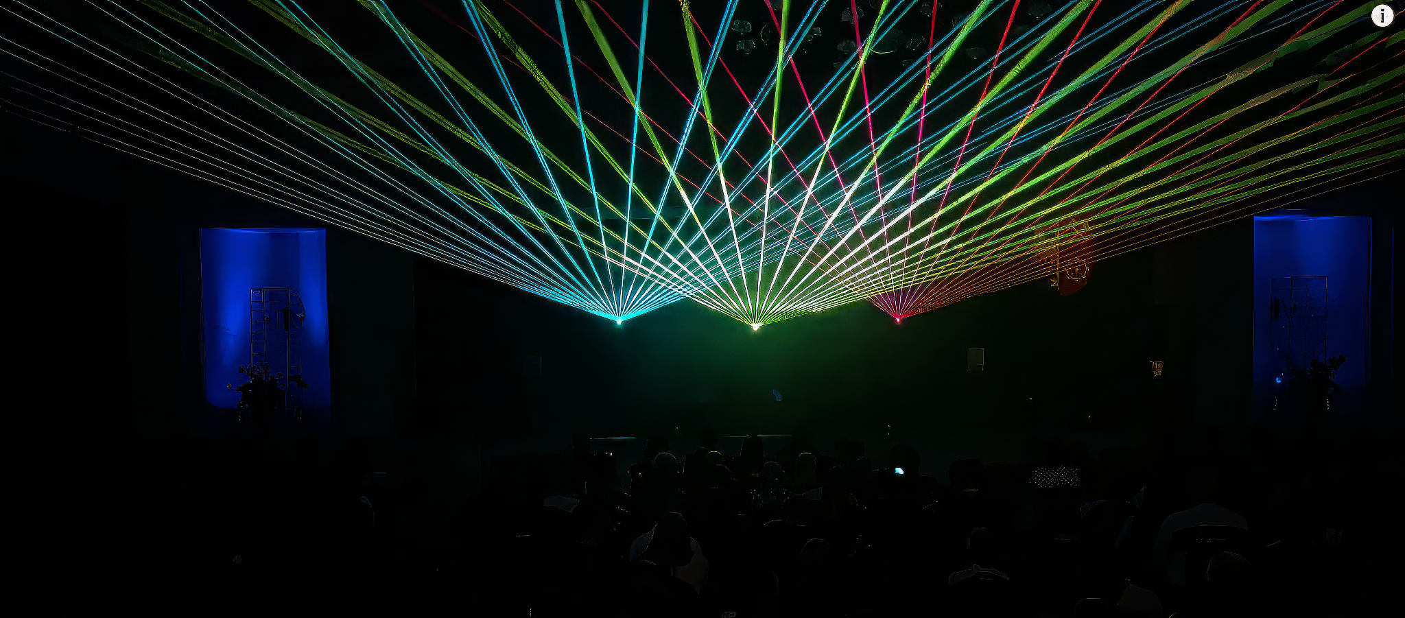 Laser lights being projected at a concert by a LaserCube projector